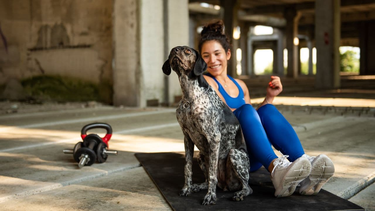 I tried this 3-move mobility routine using my dog instead of dumbbells. Here's what happened